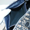 Interior view of a vintage Dior Boston Bag in navy Trotter Canvas, showcasing the zipper and fabric lining.