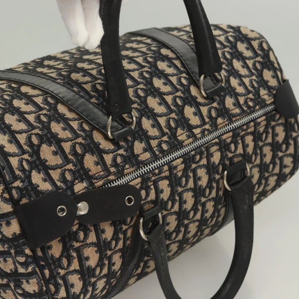 Dior vintage Boston bag in navy Trotter canvas, featuring classic design and sturdy leather handles.