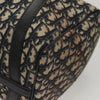 Close-up of Dior Boston Bag vintage in navy Trotter Canvas, showcasing detailed patterned fabric and leather trim.