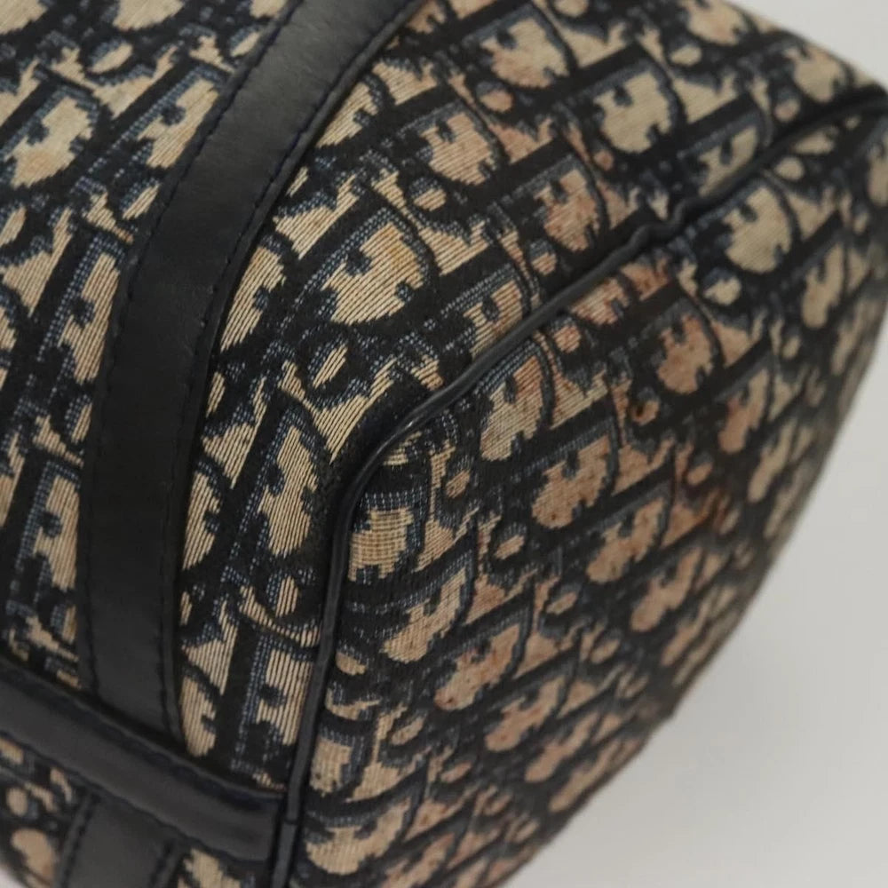 Close-up of Dior Boston Bag vintage in navy Trotter Canvas, showcasing detailed patterned fabric and leather trim.