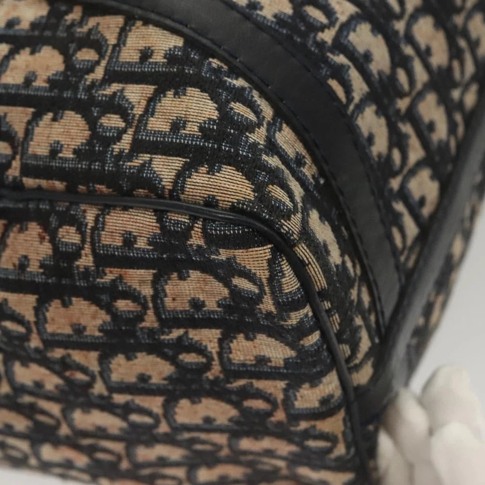 Close-up of vintage Dior Boston Bag in navy Trotter Canvas, showcasing its unique pattern and elegant design.