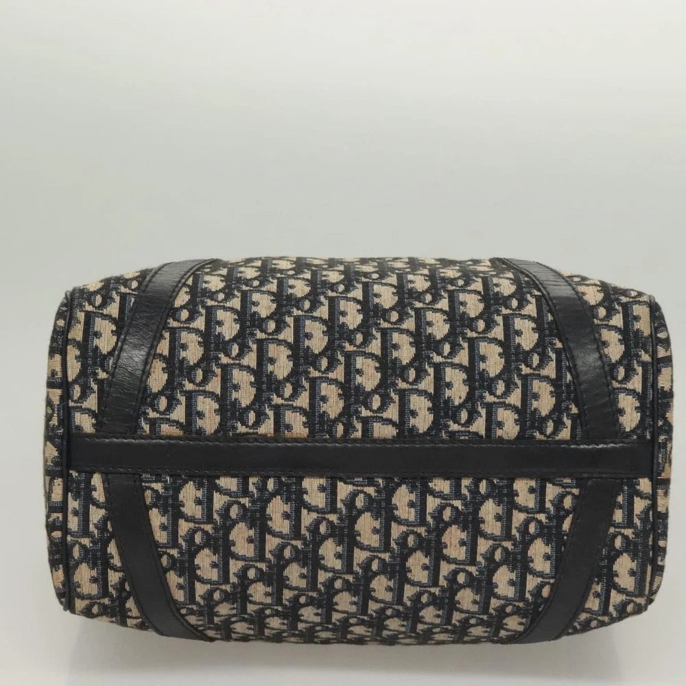 Dior Boston Bag vintage in navy Trotter Canvas, showing the bottom view and iconic Dior pattern.