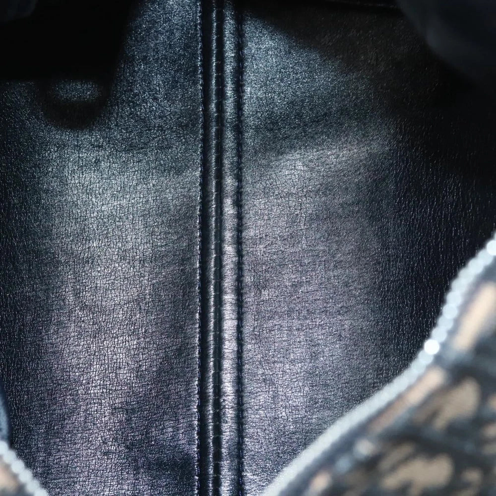 Interior view of a vintage Dior Boston Bag in navy Trotter Canvas, showcasing sleek texture and craftsmanship.